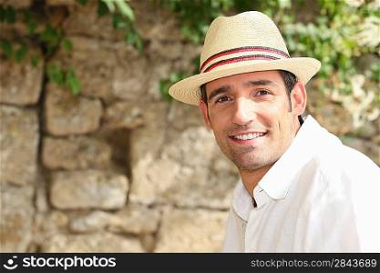 man with sunhat posing outdoors