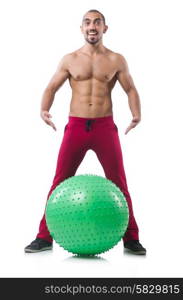 Man with swiss ball doing exercises on white