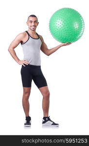 Man with swiss ball doing exercises on white