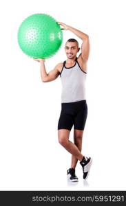 Man with swiss ball doing exercises on white