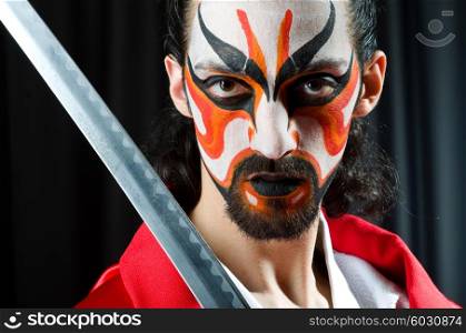 Man with sword and face mask