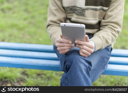 Man with tablet computer in hands.