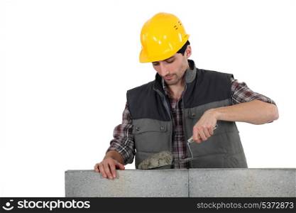 Man with trowel and cement