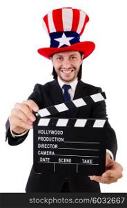Man with USA hat and movie board isolated on white