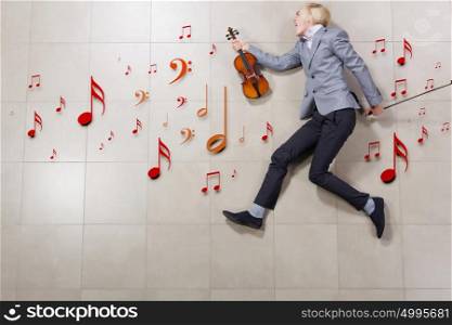 Man with violin. Funny image of running businessman with violin in hand