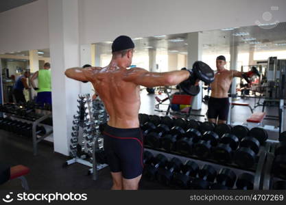 man with weight training equipment on sport gym club &#xA;&#xA;