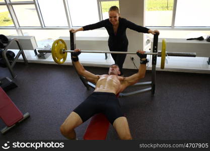 man with weight training equipment on sport gym club &#xA;&#xA;