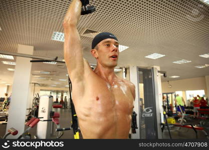 man with weight training equipment on sport gym club &#xA;&#xA;