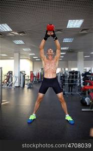 man with weight training equipment on sport gym club &#xA;&#xA;