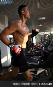 man with weight training equipment on sport gym club &#xA;&#xA;