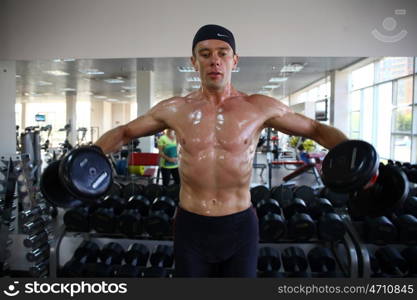 man with weight training equipment on sport gym club &#xA;&#xA;