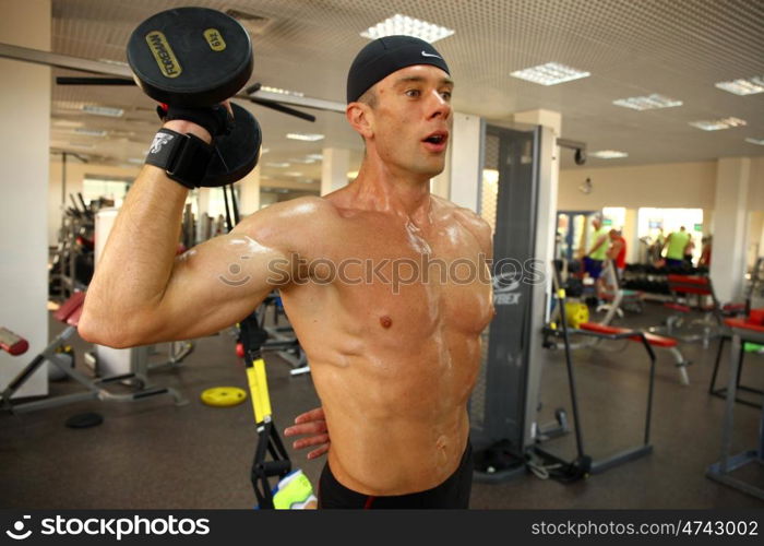 man with weight training equipment on sport gym club &#xA;&#xA;