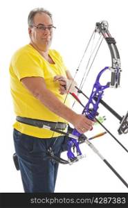 Man with yellow shirt and jeans standing with a longbow