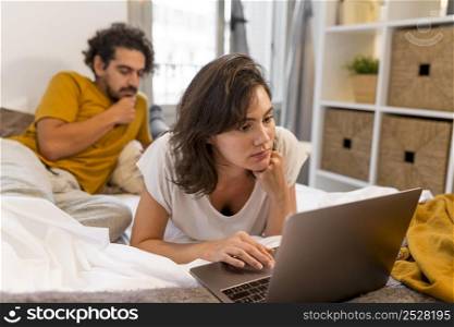 man woman checking their devices