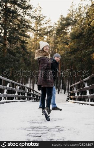 man woman outdoors together during winter