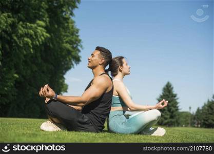 man woman practicing yoga outdoor
