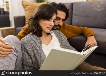 man woman reading together