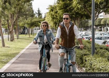 man woman riding their bikes