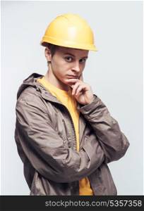 Man worker in a yellow helmet