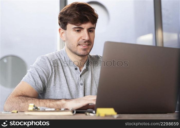 man working as lancer home his laptop
