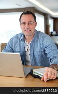 Man working at home on laptop computer