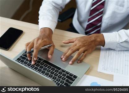 Man working by using a laptop computer Hands typing on keyboard. writing a blog. Working at home are in hand finger typewriter.