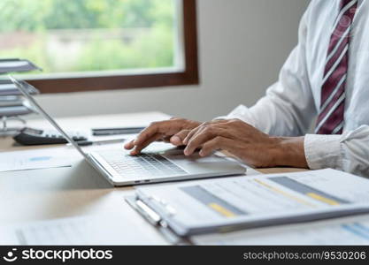 Man working by using a laptop computer Hands typing on keyboard. writing a blog. Working at home are in hand finger typewriter.