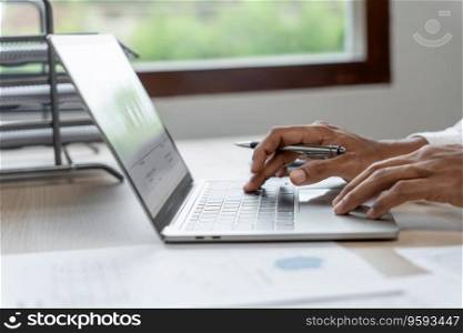 Man working by using a laptop computer Hands typing on keyboard. writing a blog. Working at home are in hand finger typewriter.