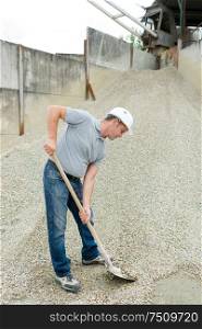 man working in a pebble factory