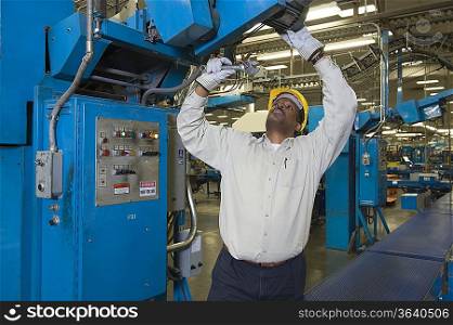 Man working in newspaper factory