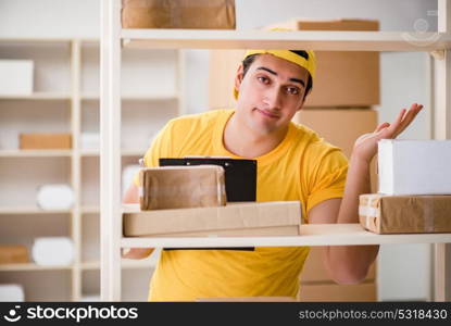 Man working in postal parcel delivery service office