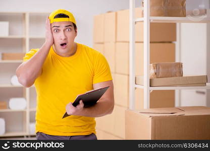 Man working in postal parcel delivery service office