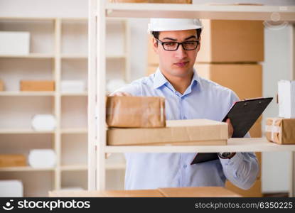 Man working in postal parcel delivery service office