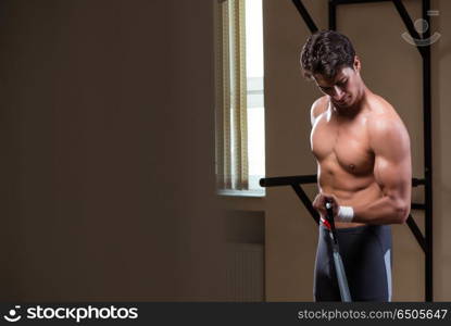 Man working in the gym with springs