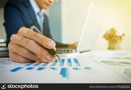 Man Working Laptop Connecting Networking Concept with many document graph data, business new plan.