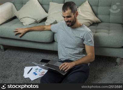 man working laptop couch
