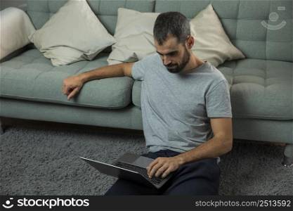 man working laptop sofa
