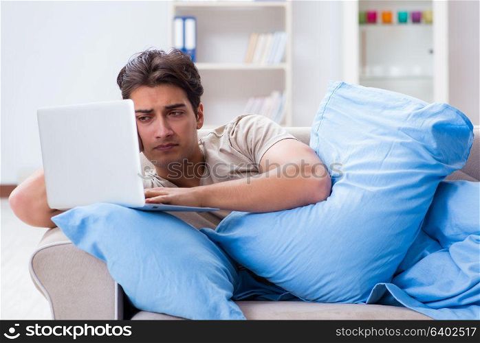 Man working late at his laptop at home