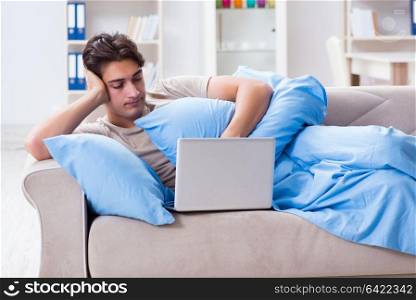 Man working late at his laptop at home