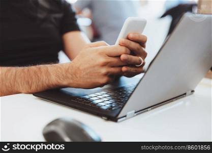 Man Working on the Laptop and Texting with Someone on Business. Body Part. Conceptual Photo of Work Process. Successful People Life.. Businessman Working in the Office