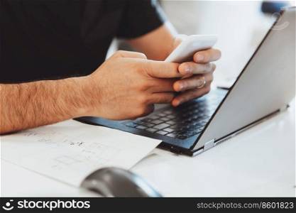Man Working on the Laptop and Texting with Someone on His Workplace. Body Part. Conceptual Photo of Work Process.. Business Man in the Office