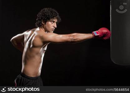 Man working out with a punching bag