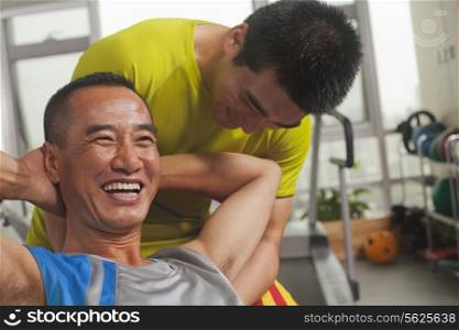 Man working out with his trainer
