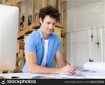 Man working with drafts in office