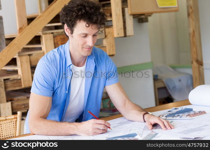 Man working with drafts in office