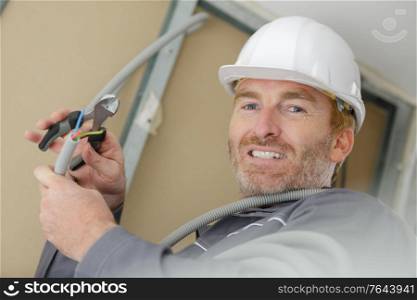 man working with electric box at house
