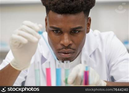 man working with liquids in lab
