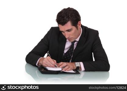 Man writing in a diary