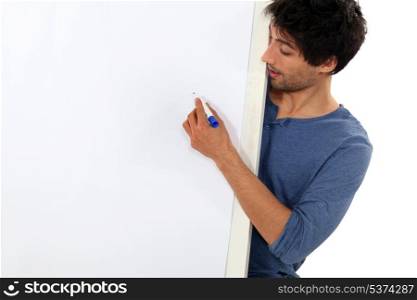 Man writing on a whiteboard