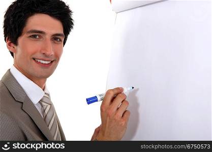 Man writing on flip chart